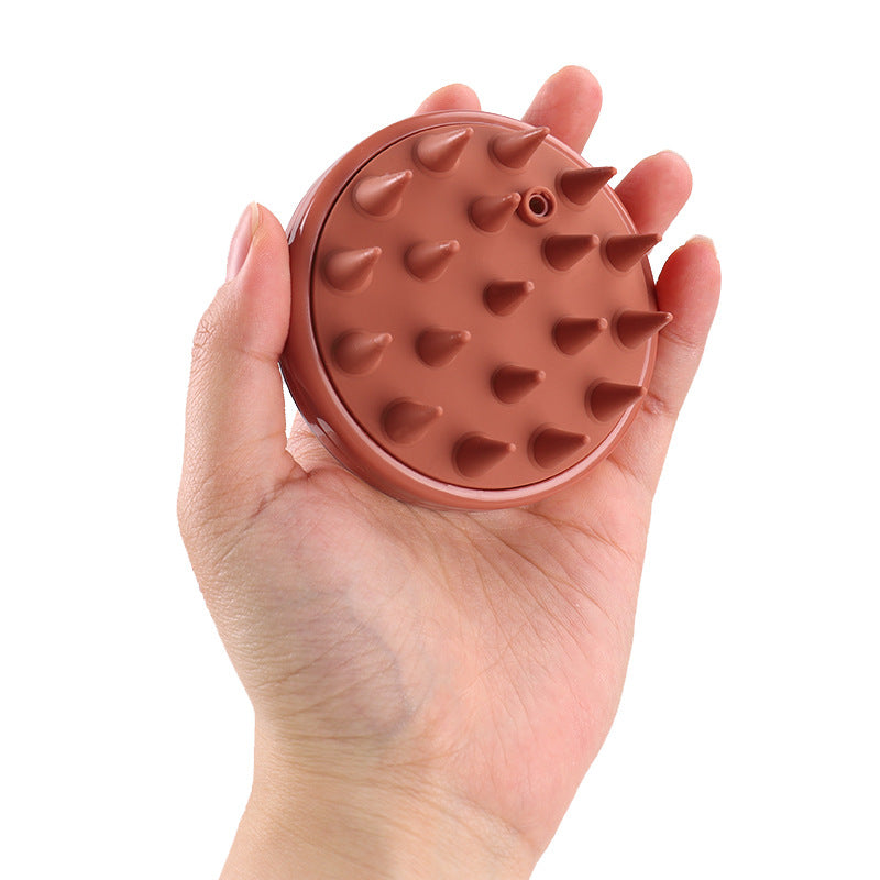 Silicone shampoo massage brush that dispenses shampoo